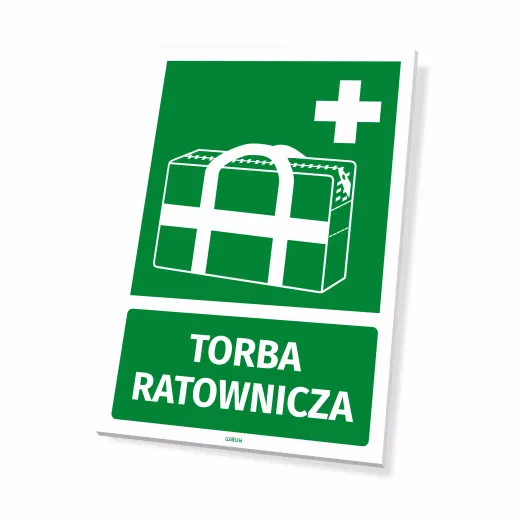Zielona tabliczka BHP z białym piktogramem krzyża i torby oraz napisem TORBA RATOWNICZA, pokazana jako gotowy produkt