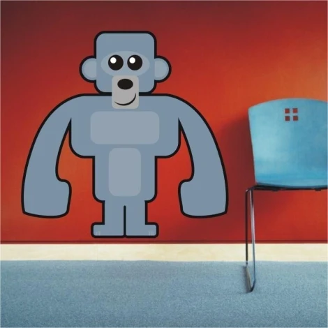 Urocza naklejka goryla na czerwonej ścianie, idealna do nowoczesnego pokoju dziecięcego.